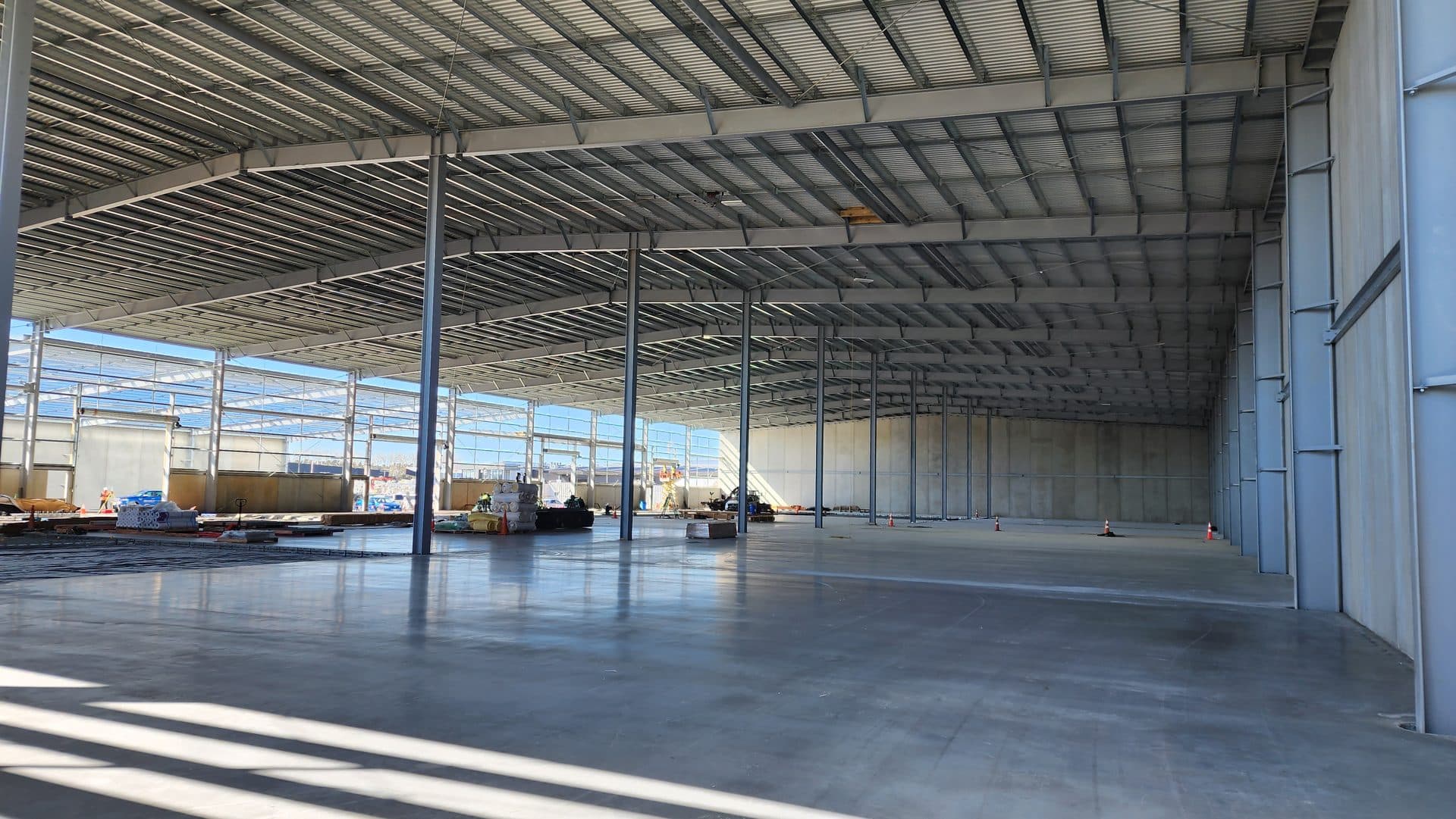 Concrete warehouse slab inside a new steel-framed building