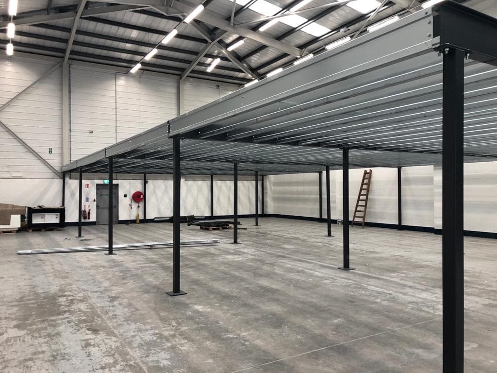Bare steel mezzanine frame before the plywood decking goes down