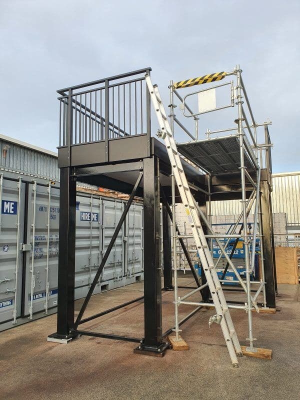 Crew bolting together a modular steel mezzanine on site