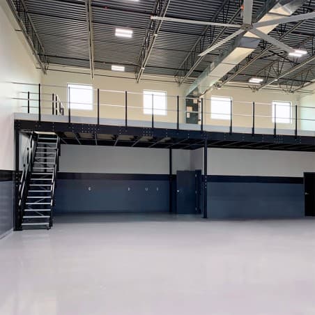 Engineered steel mezzanine frame with the connection plates an extension bolts to